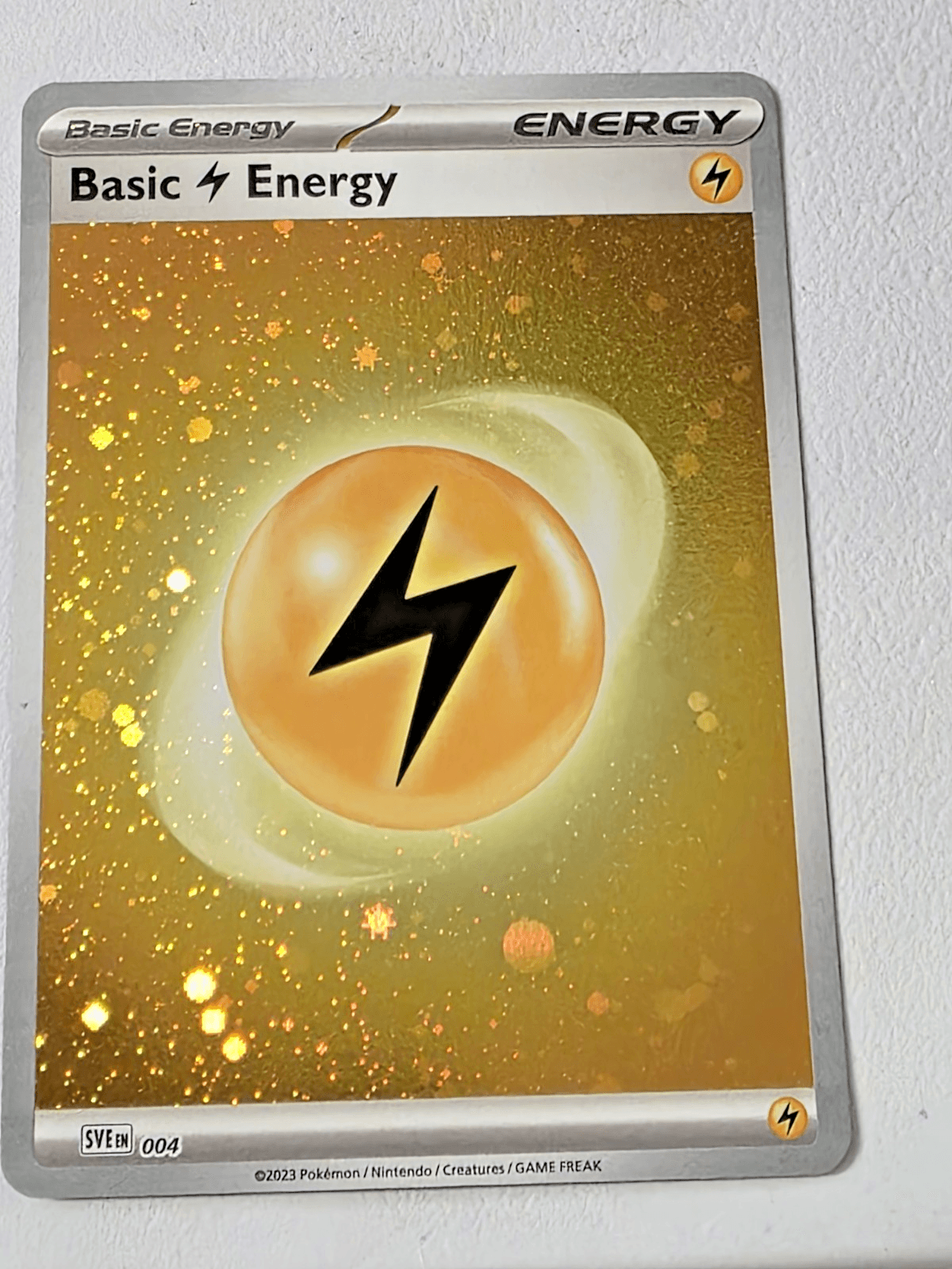 Pokemon TCG Lightning Energy SVE 004 Cosmos Holo NM