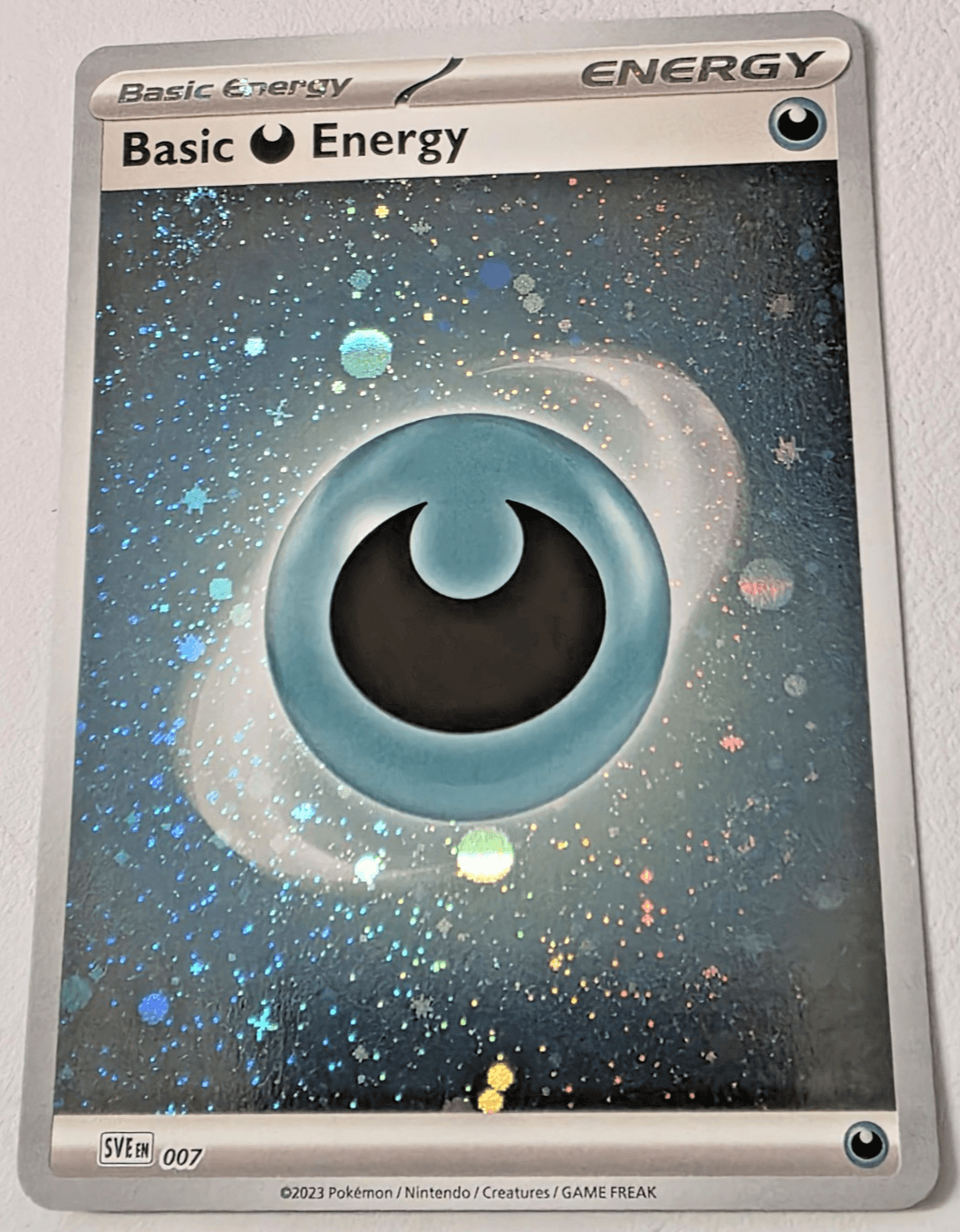 Pokemon TCG Basic Darkness Energy Cosmos Holo with 2 Swirls Scarlet & Violet NM