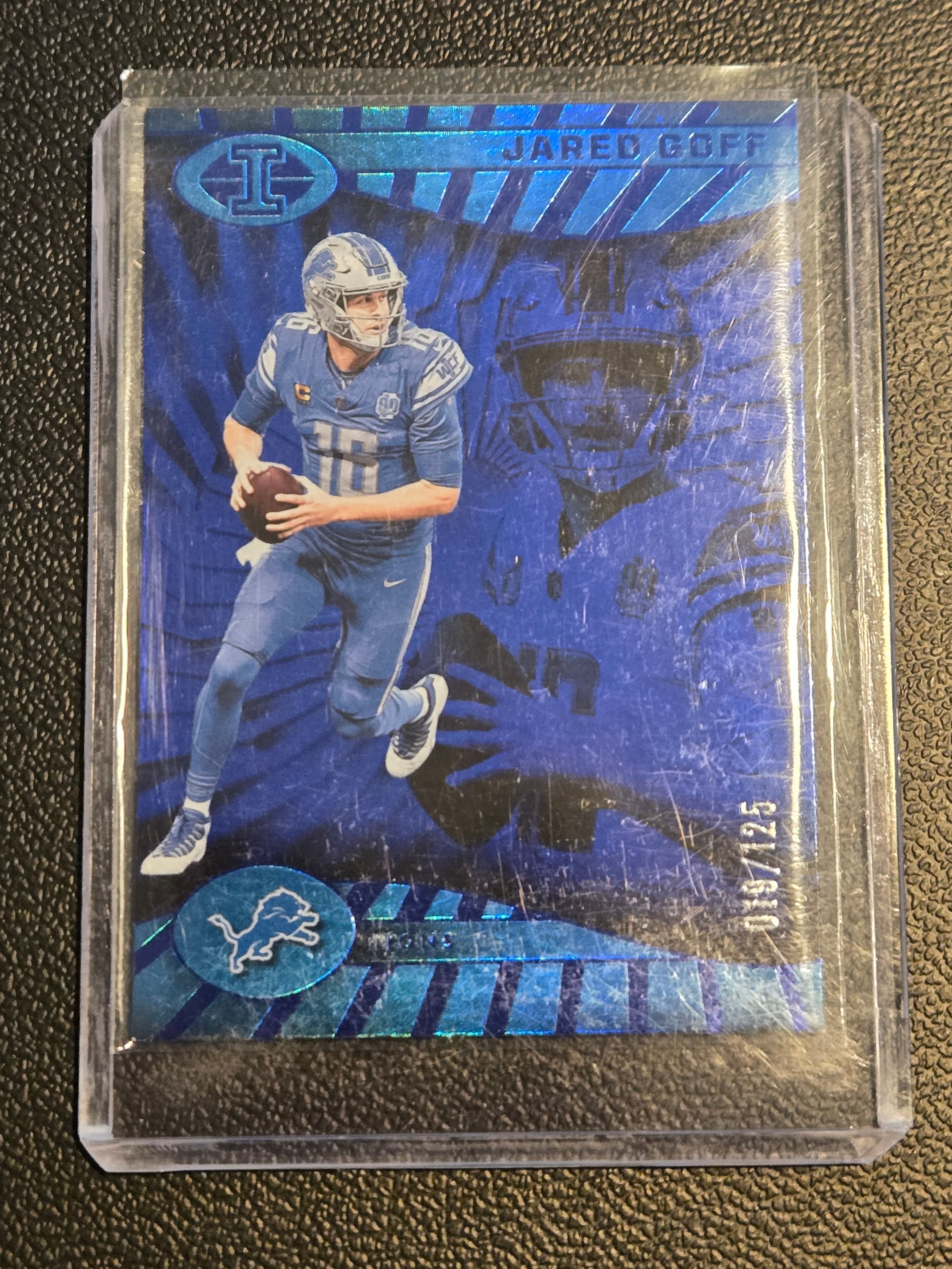 2024 Panini Illusions #25 Jared Goff Blue Trophy Collection 119/125 - Image 1
