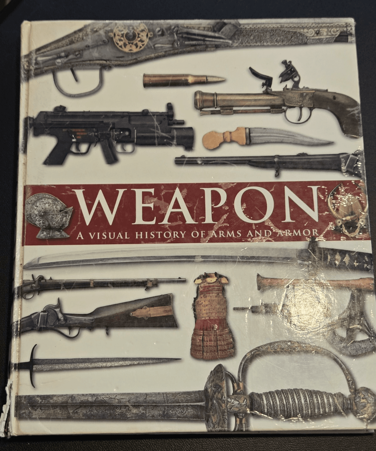 Weapon: A Visual History of Arms and Armor Hardcover – Covent Garden Books - Image 1