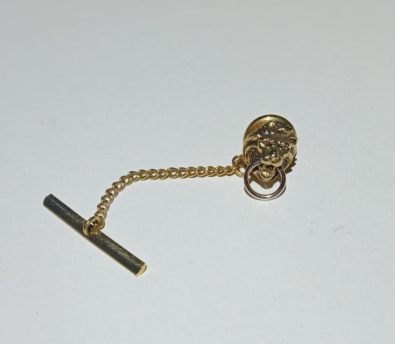 Vintage Swank Gold Tone Lion Head Door Knocker Tie Tack with Safety Chain & Bar - Image 1