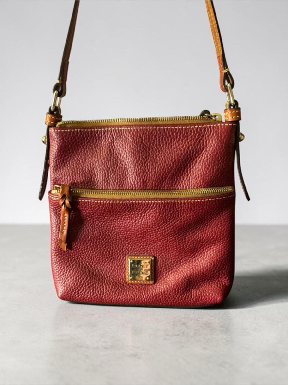Dooney & Bourke Wine Red Pebbled Leather Crossbody - Image 1