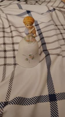 Porcelain Hand Painted Bell with Child Figurine, Floral Pattern, Matte Finish - Image 1