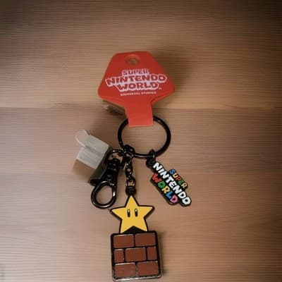 New Super Mario Star Block Enamel Keychain Nintendo World Universal Studios - Image 1