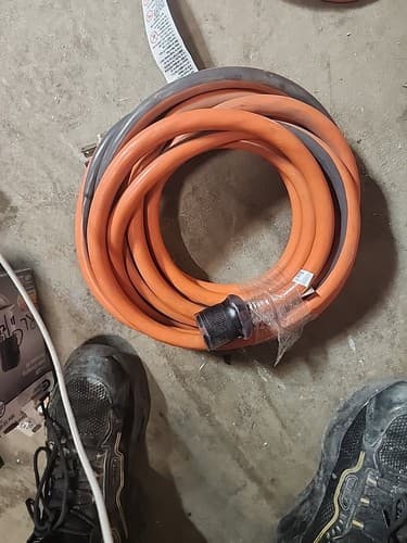 RIDGID 25 ft 10/4 Heavy Duty Outdoor L14-30 Amp Generator Lighted Extension Cord - Image 1