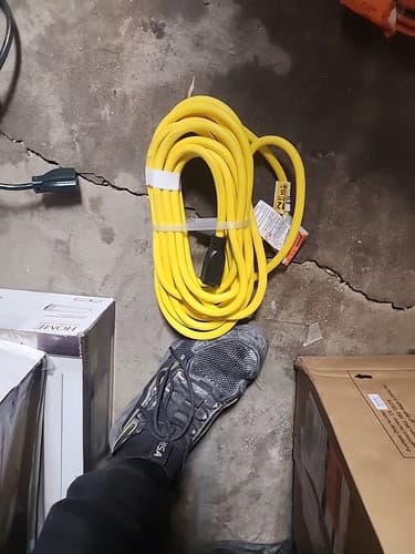 New Husky 25 ft. 12/3 Yellow Indoor/Outdoor Extension Cord - Image 1