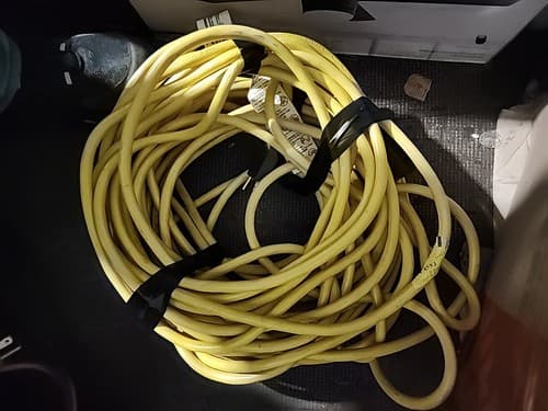 Husky 100 ft. 12/3 Indoor Outdoor Extension Cord Yellow 15A 125V 1004823555 - Image 1