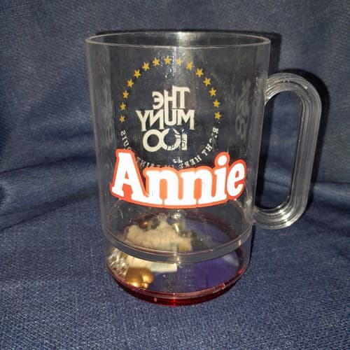 Vtg Annie 100 Yrs Howw Mfg Cup Mug W/Toys Trinket Bottom The Muny Live Theater - Image 1