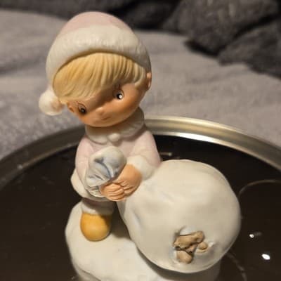 Porcelain Christmas Child with Snowball Figurine Hand Painted Seasonal Decor - Image 1