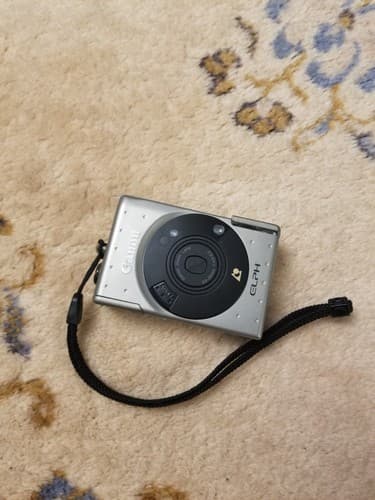 Canon IX 240 ELPH APS Point and Shoot Film Camera Silver Untested For Parts - Image 1