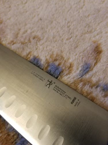 J.A. HENCKELS Hi Definition 7" Hollow Edge SANTOKU Knife 19478-180 - Thumbnail 4