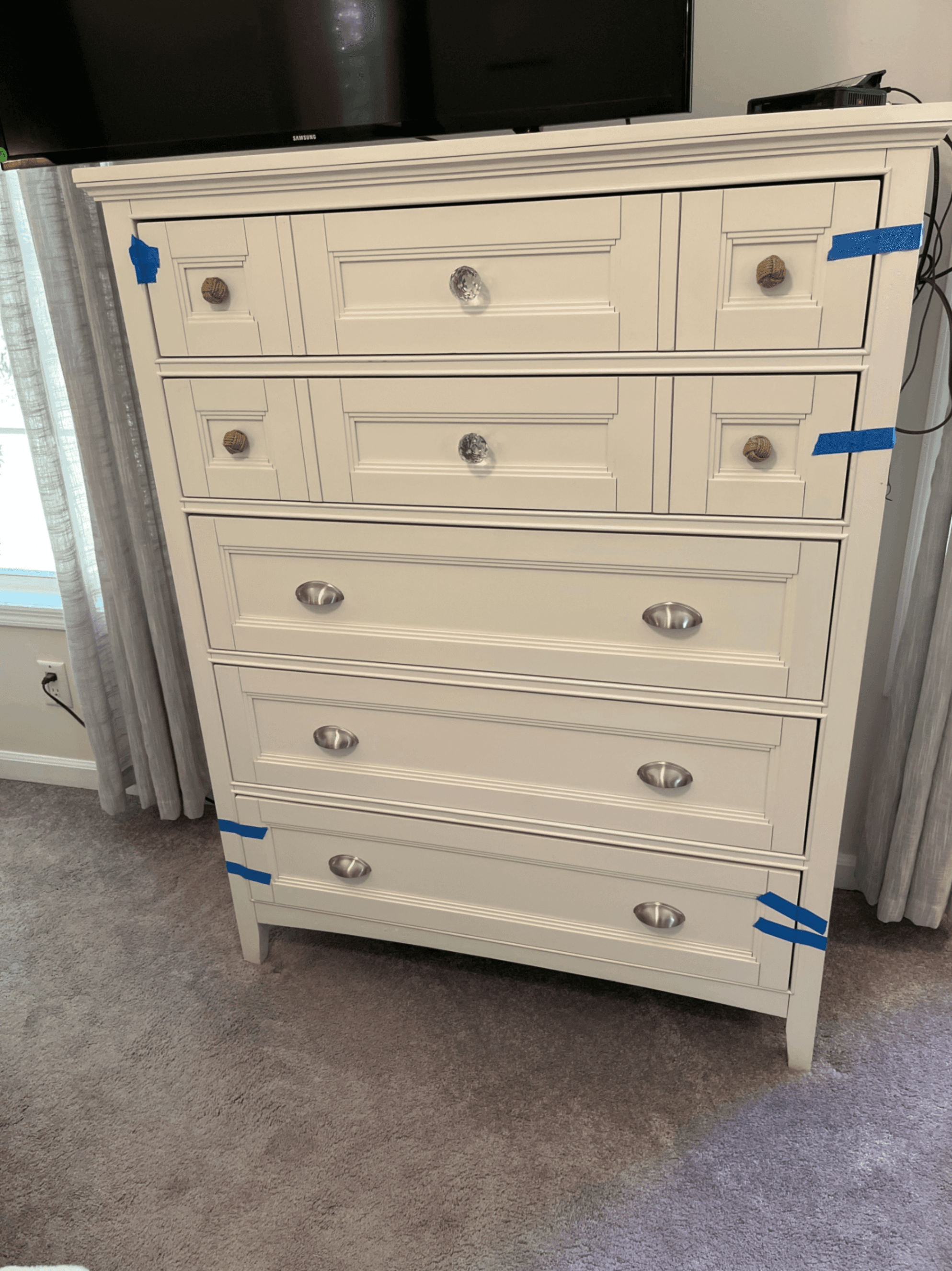 White Wooden Dresser with Multiple Drawers - Image 1