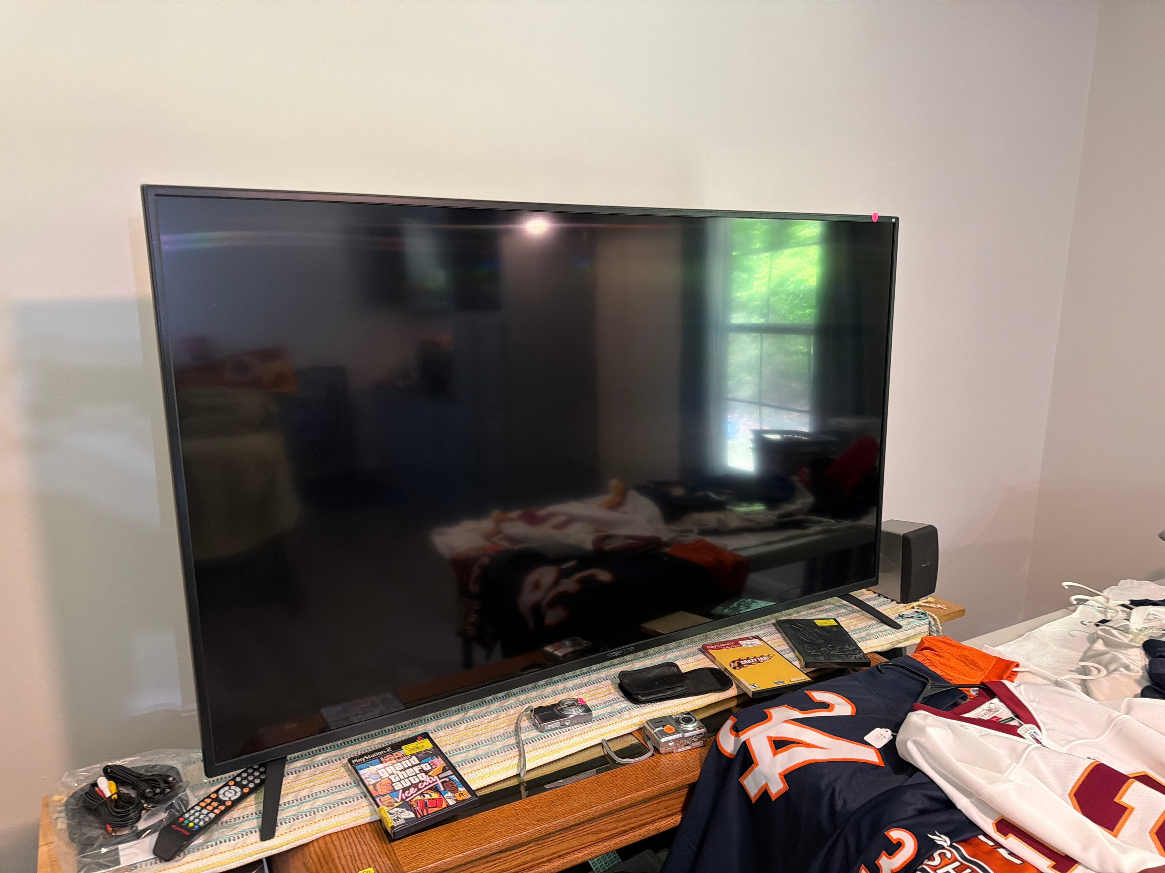Flat Screen TV with Remote and Cables - Image 1
