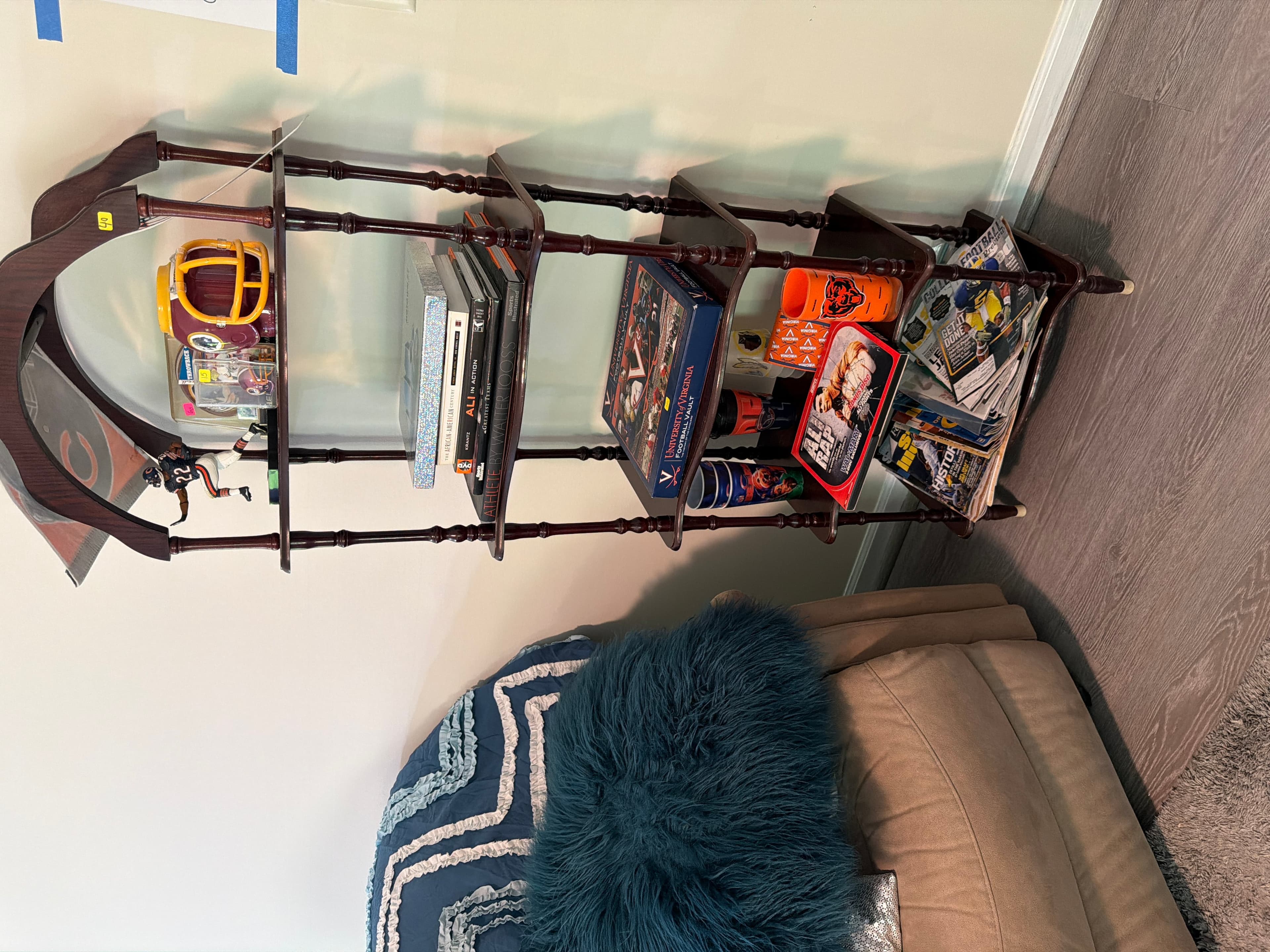 Vintage Wooden Display Shelf with Sports Memorabilia - Image 1