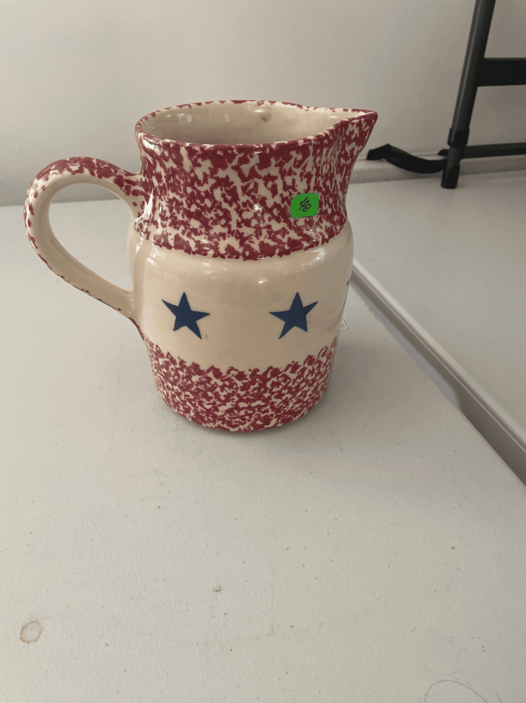 Red and White Speckled Ceramic Pitcher with Blue Stars - Image 1