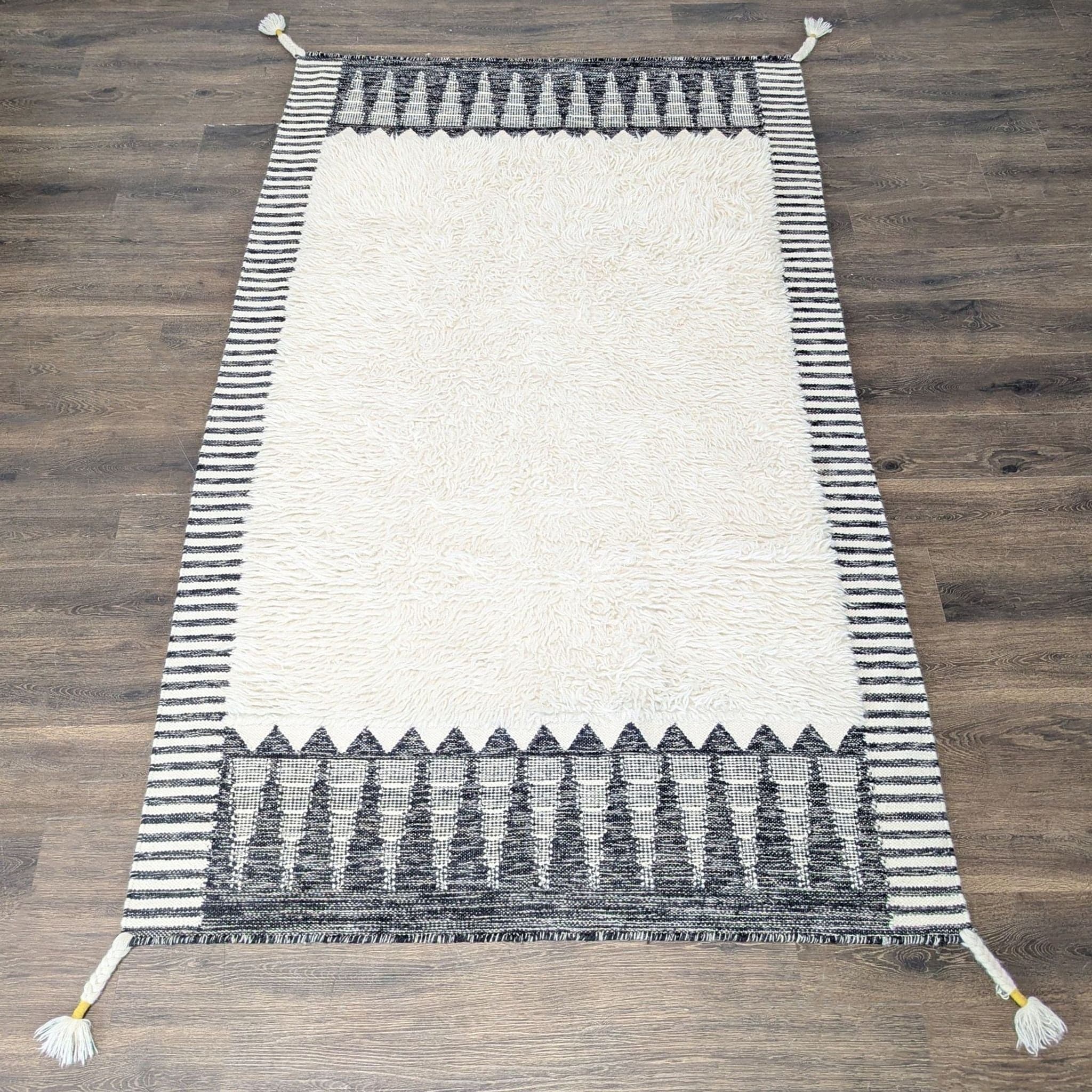 West Elm Ikat 5’x8’ Black and White Shag Rug with Geometric Pattern, Modern Style - Image 1