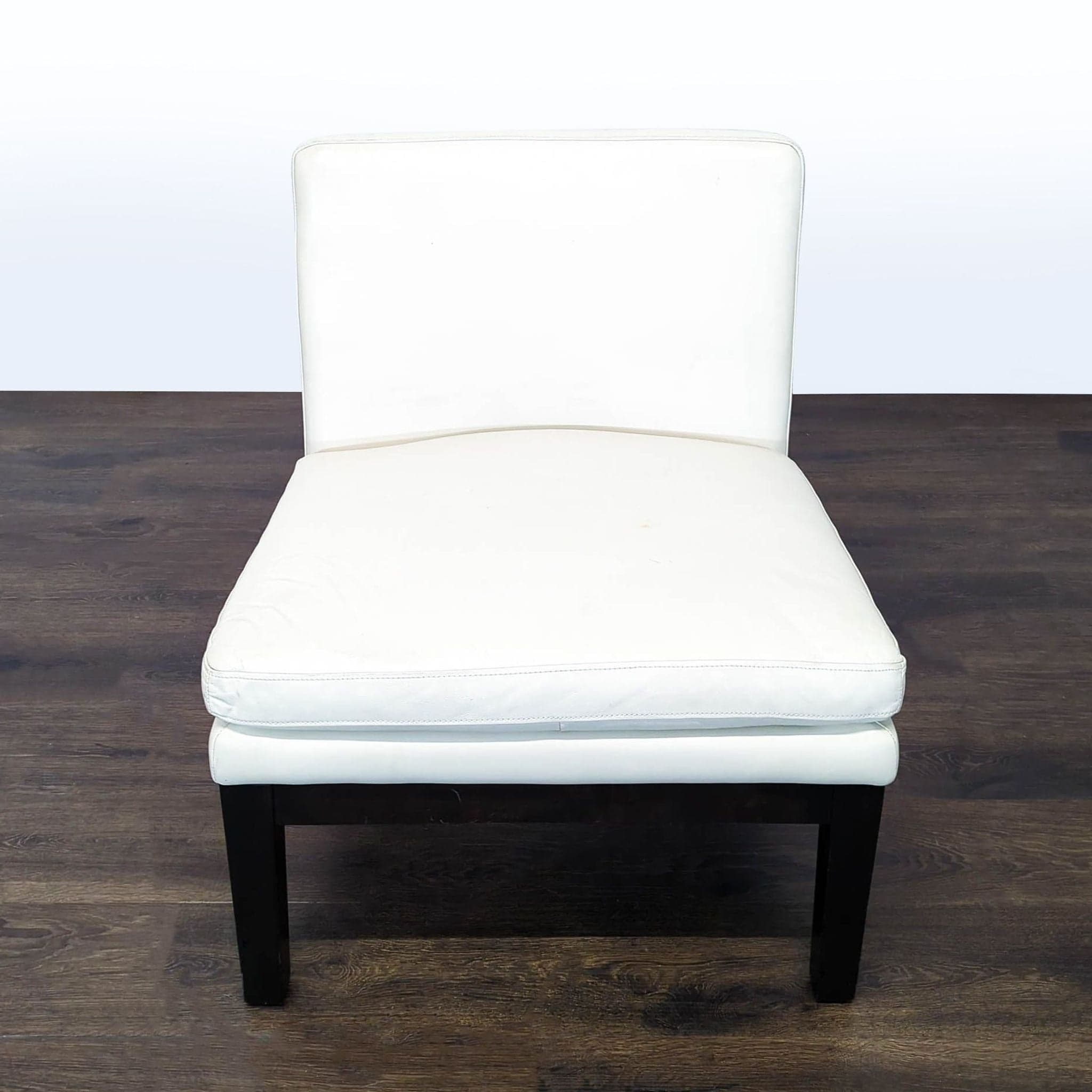 Modern White Armless Faux Leather Lounge Chair with Black Wooden Legs - Image 1