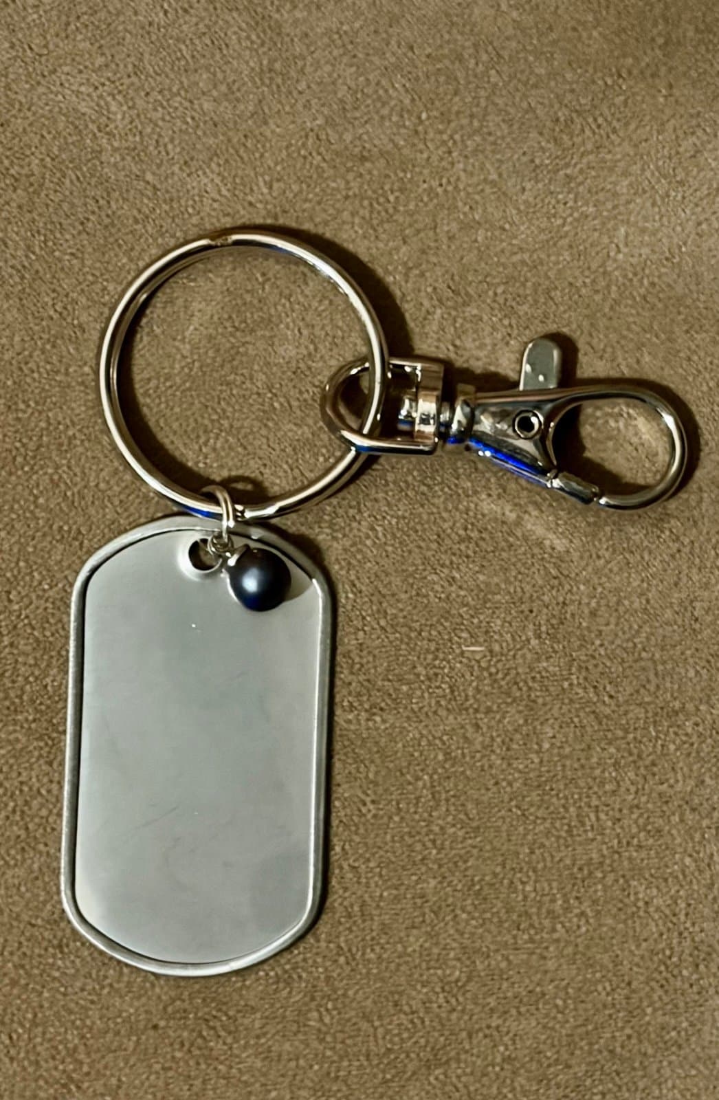 Silver Dog Tag Keychain with blue pearl - Image 1