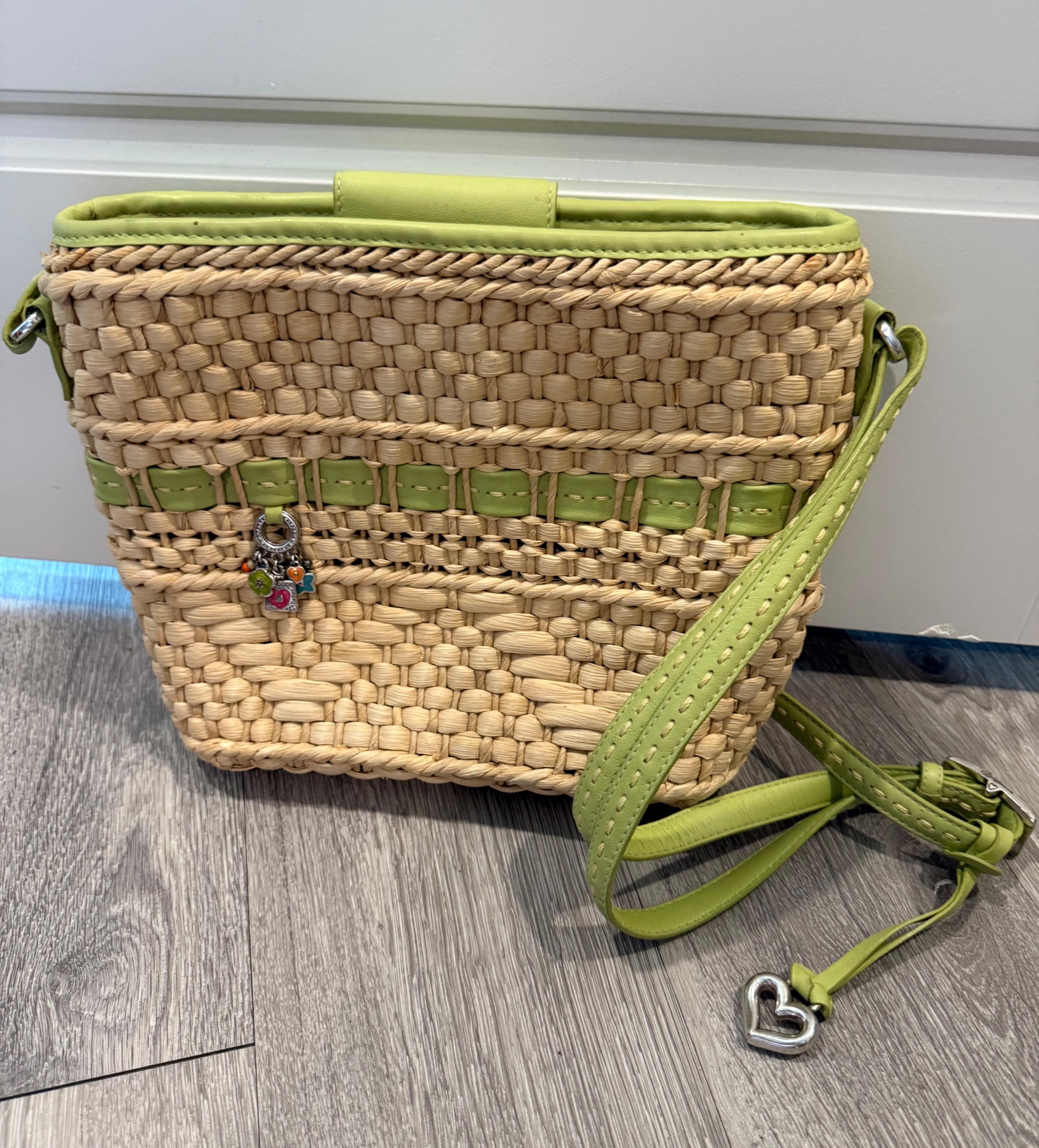 Brighton Straw Woven Crossbody Bag with Green Accents and Charms - Image 1