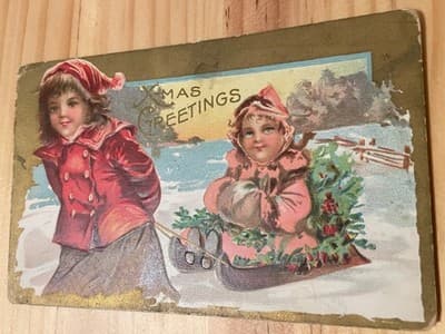 Vintage Xmas Greetings Postcard Children Sled Snow Holiday Embossed Greeting - Image 1