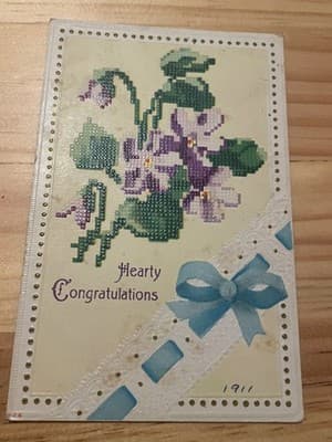 Vintage 1911 Embossed Floral Greeting crossstitch Postcard Gold Foil Handwritten - Image 1