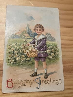 Vintage Embossed Birthday Postcard Child Daisies Purple Outfit Floral Emboss - Image 1