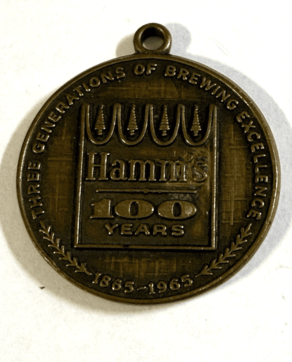 Hamm's Beer 100 Year Anniversary metal keychain fob 1965 - Image 1
