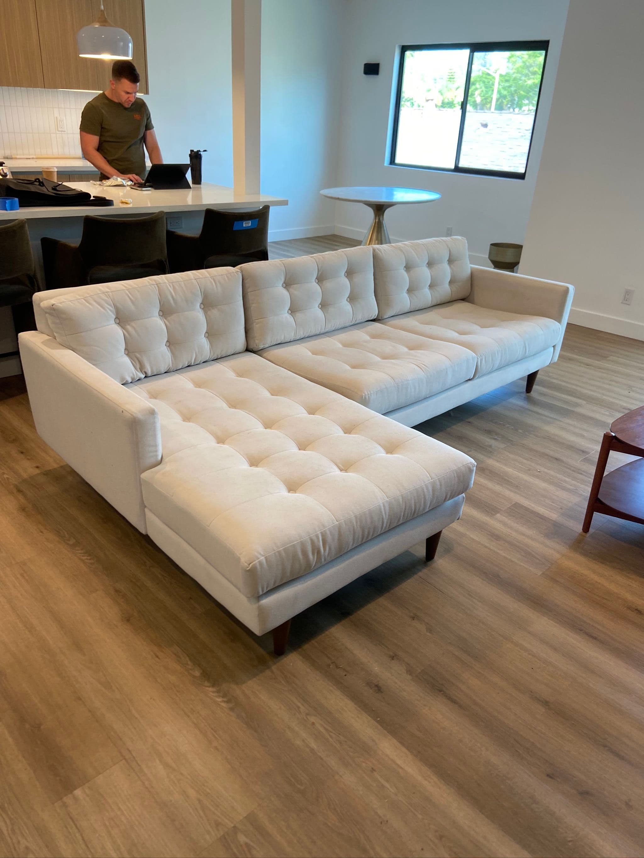 Cream Tufted Sectional Sofa by CB2 - Image 1