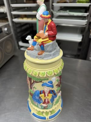 Vintage German Ceramic Beer Stein With Figures On Lid 15” Tall 1968 - Image 1