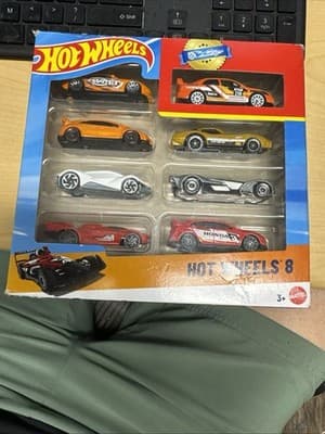 Hot Wheels, Set of 8 Basic Toy Cars & Trucks in 1:64 Scale, Includes 1 Exclusive - Image 1