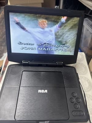 RCA 9 Inch Portable DVD Player With Chargers + 5 DVD - Image 1