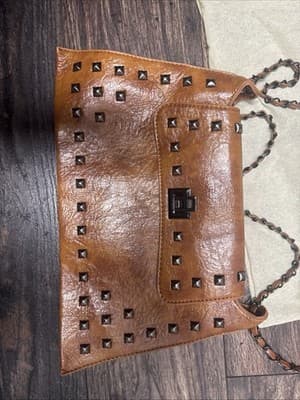 rivet crossbody bag brown leather with faux interior - Image 1