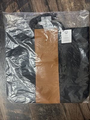 MCM Tote Bag NEW Black Tan Faux Leather Embossed Logo Sealed - Image 1