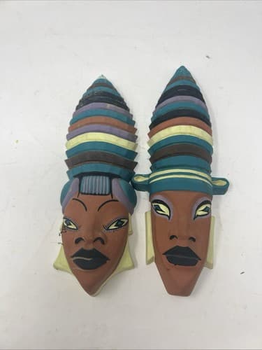 Pair of signed Boehm 1957 tribal African hanging terra-cotta face masks