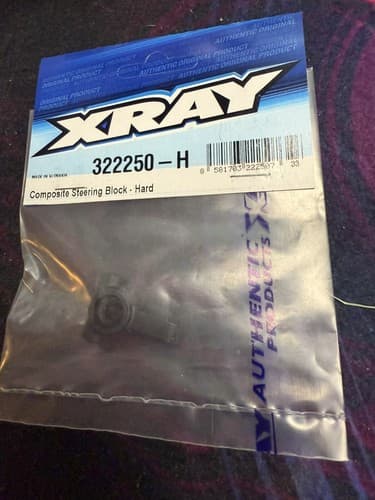 XRAY 322250-H - Composite Steering Block, Hard - Image 1