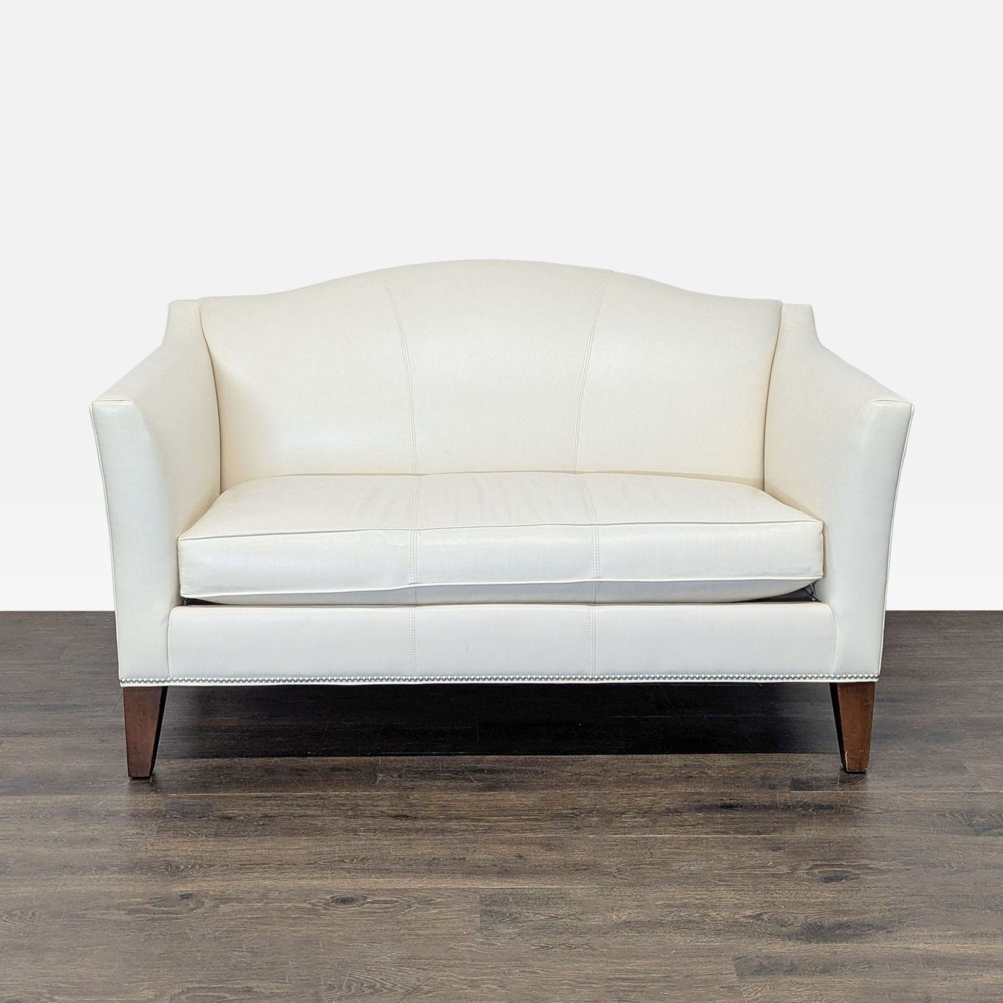 Ethan Allen Cream Leather Loveseat with Wood Legs - Image 1