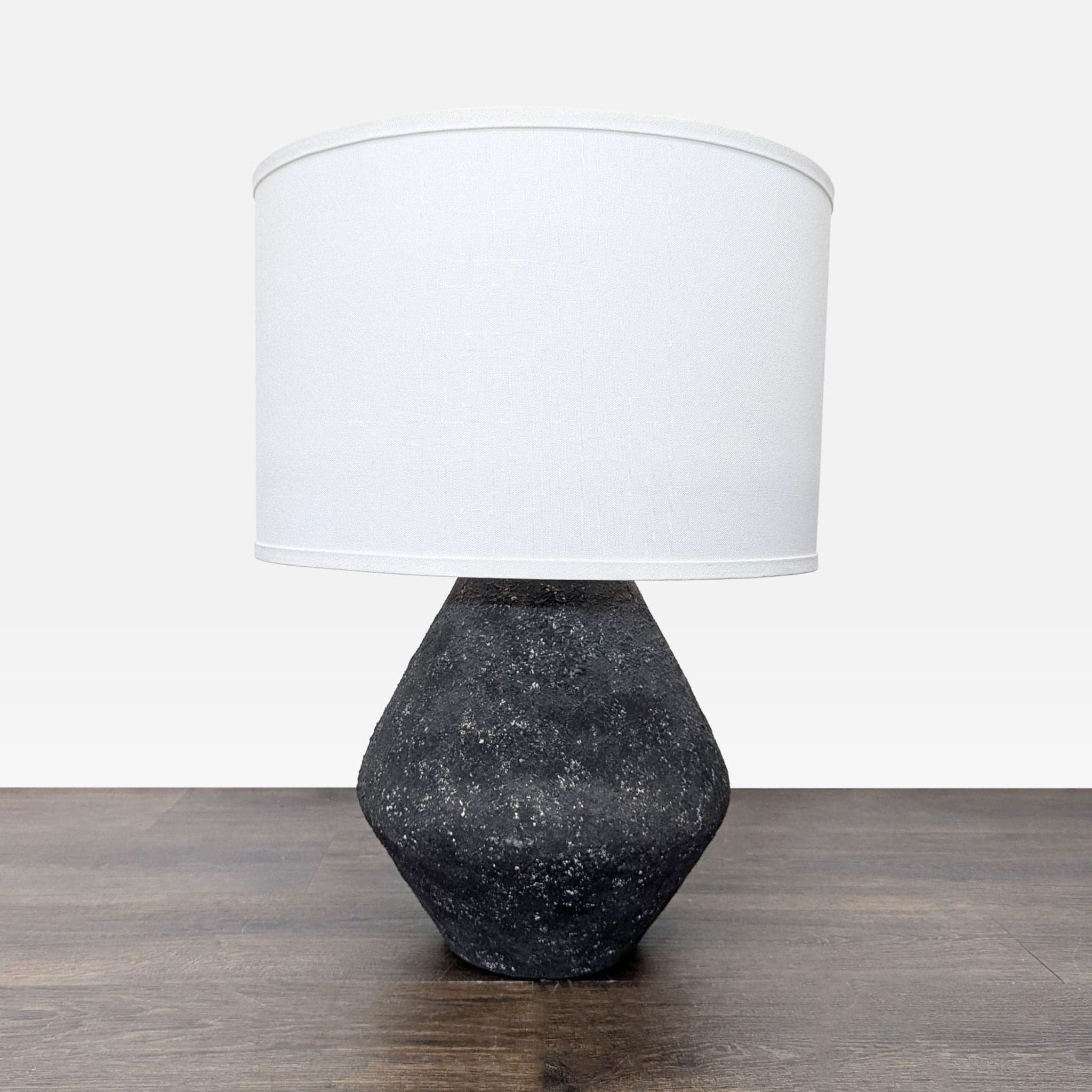 Troy Lighting Artifact Modern Table Lamp with Textured Black Base and White Shade - Image 1