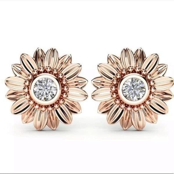 The Dainty Daisy gold and crystal flower stud earrings - Image 1