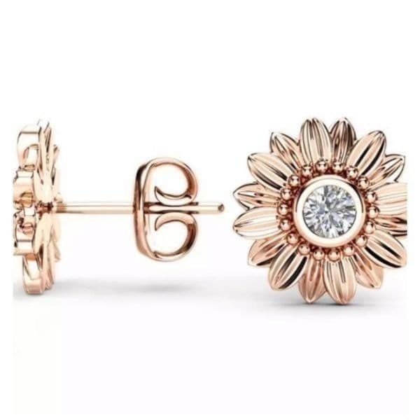 Dainty rose gold and crystal flower stud earrings. - Image 1