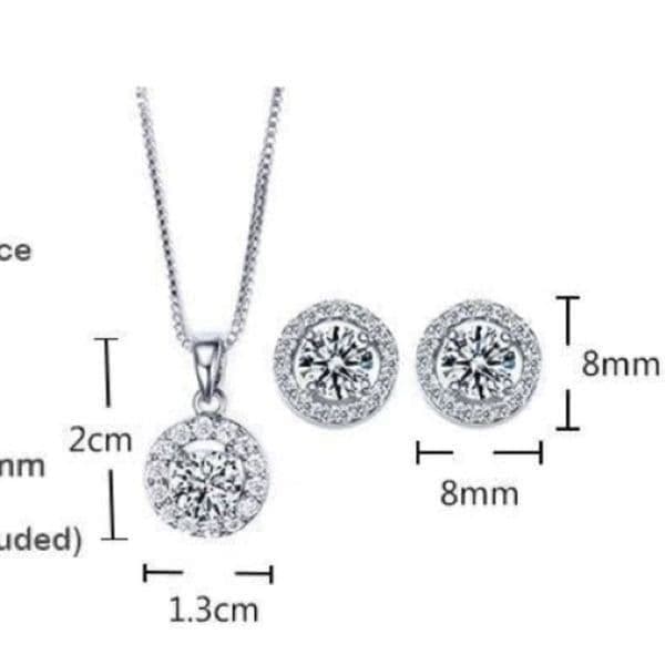 The Dainty Solitaire pendant necklace and stud earrings set in sterling silver - Thumbnail 6