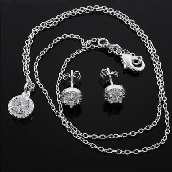 The Dainty Solitaire pendant necklace and stud earrings set in sterling silver - Thumbnail 3