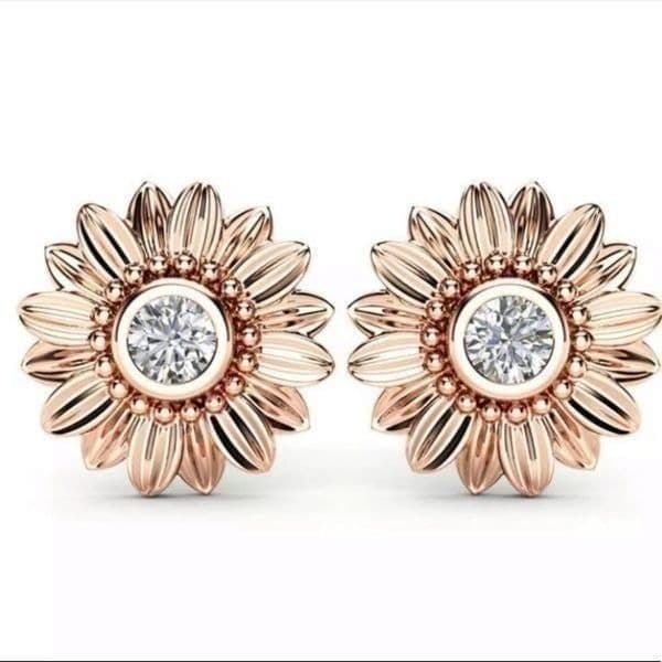 The Dainty Daisy gold and crystal flower stud earrings - Image 1