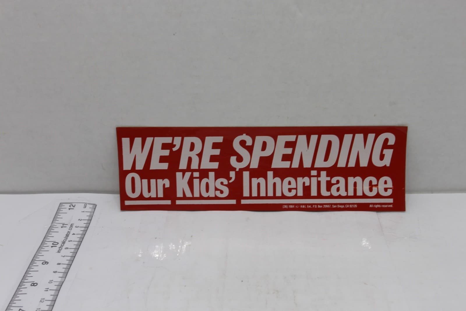 10in x 3in Bumper Sticker "We're Spending Our Kids Inheritance" 1984 - Image 1