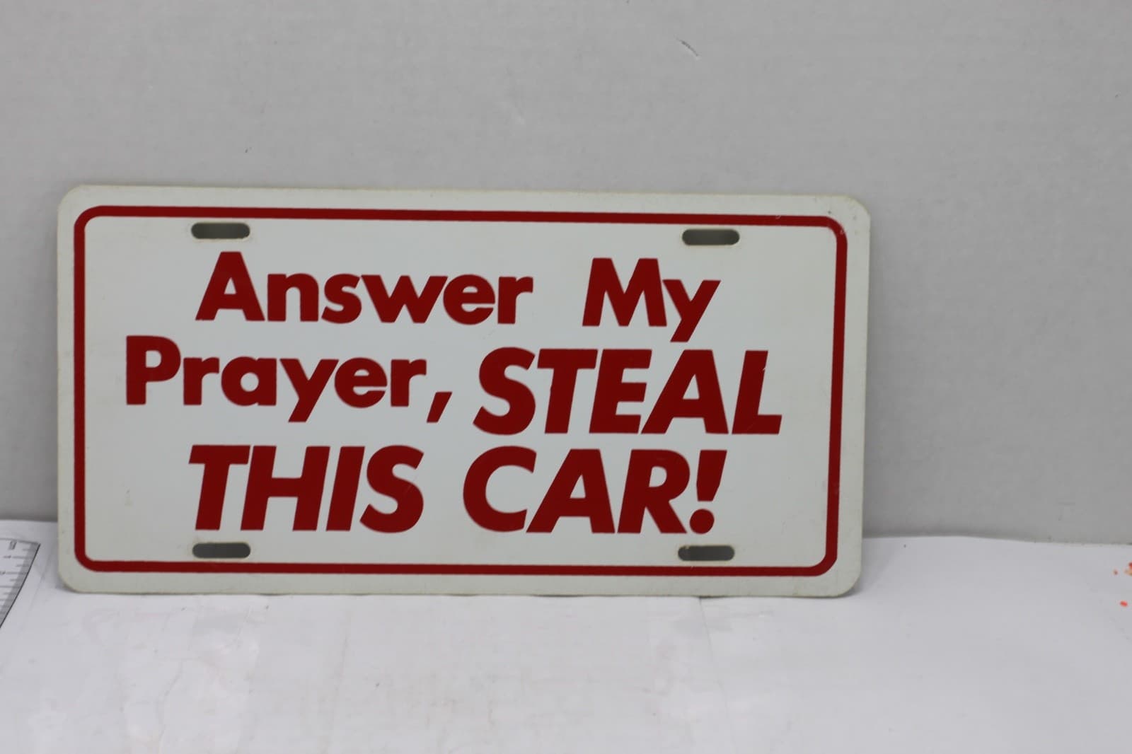 New Old Stock Novelty License Plate "Answer My Prayer, Steal This Car" - Image 1