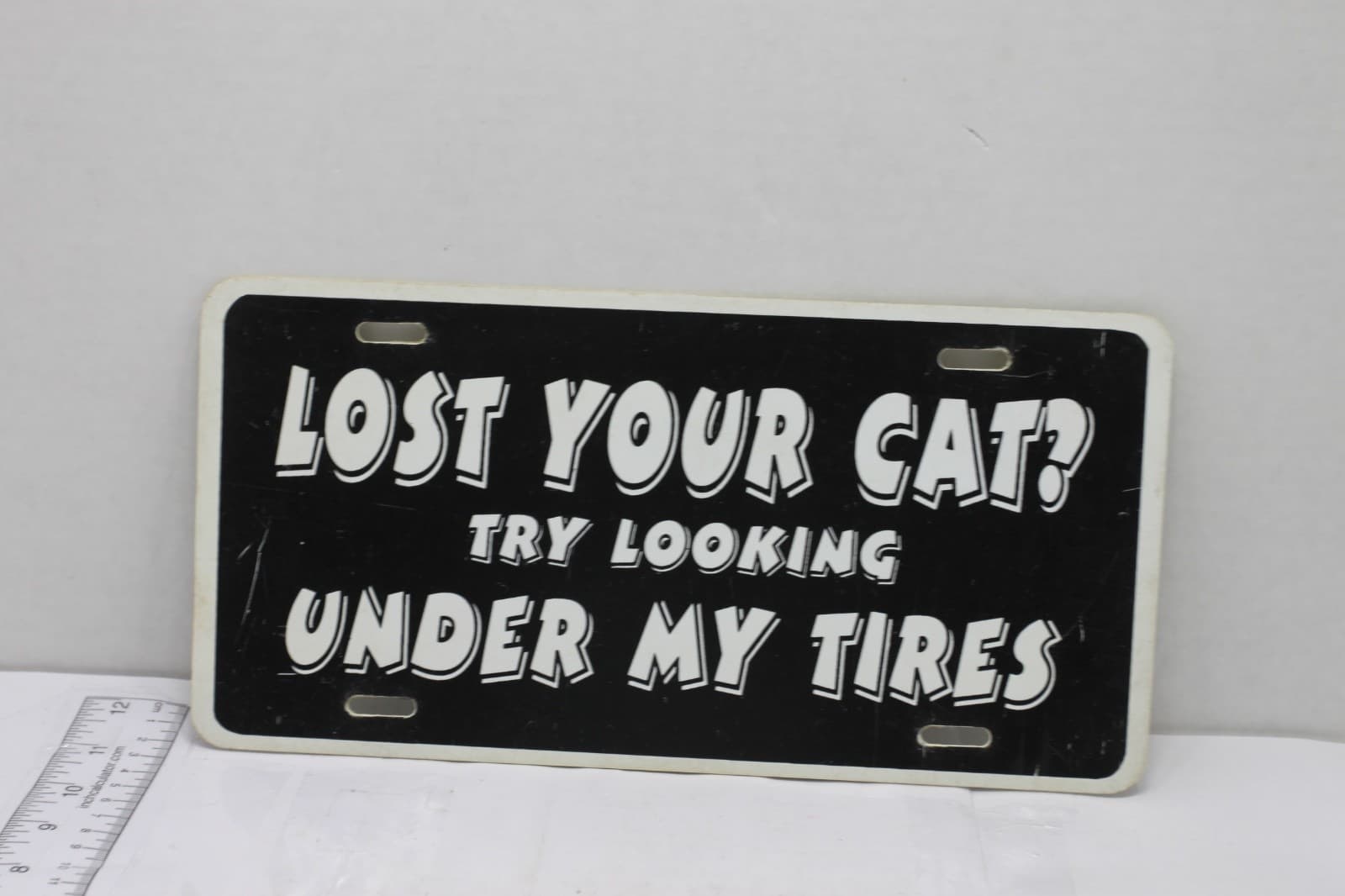 New Old Stock Novelty License Plate "Lost your Cat try looking under my tires" - Image 1