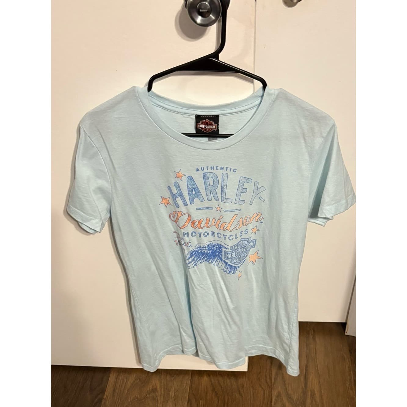 Harley-Davidson Wichita Falls TX Light Blue Tee with Orange & Blue Logo