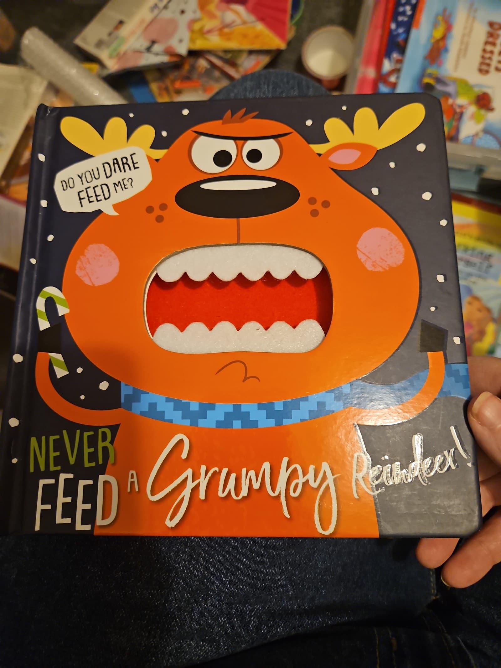 Never feed a grumpy reindeer. Board book. Buy 3 books, get 1 free - Image 1