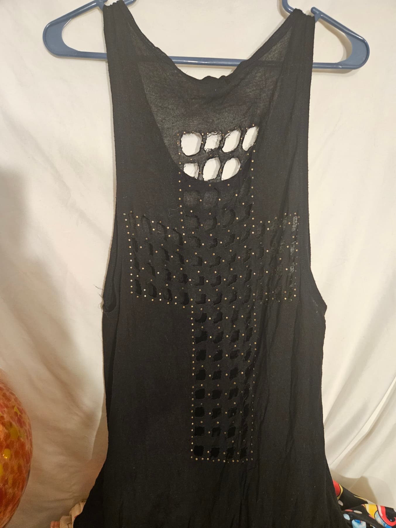 Black Sleeveless Top with Cutout Cross Design - Image 1