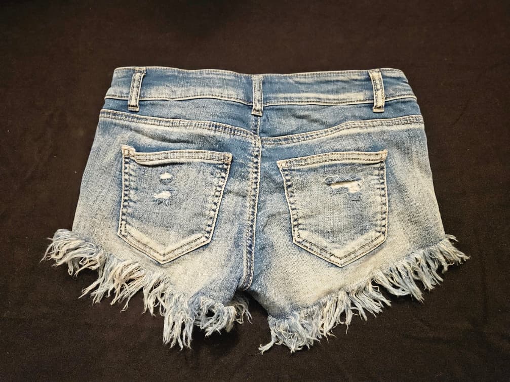 Distressed Denim Cutoff Shorts with Frayed Hem - Image 1