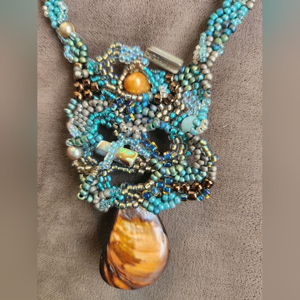 Handcrafted Beaded Necklace with Pearl Crystal and Shell Accents